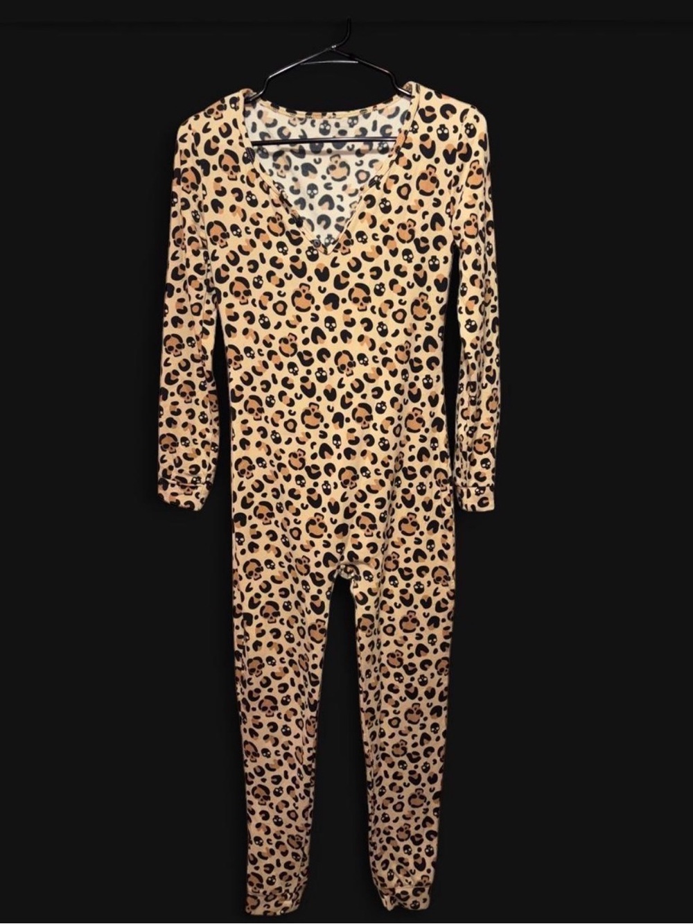 Women's leopard and skull print onesie